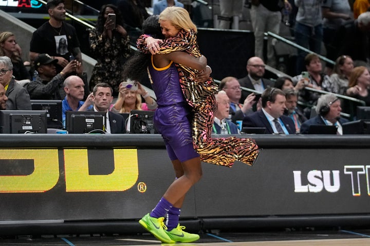 LSU head coach Kim Mulkey celebrates with Flau'jae Johnson during the second half of the NCAA Women's Final Four championship basketball game.