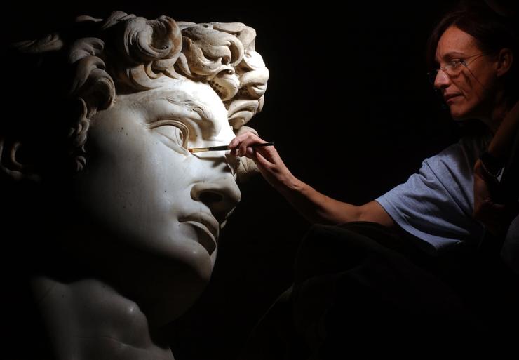 Restorer Cinzia Parnigoni cleans Michelangelo's "David" during restoration work in 2003 at the Galleria dell'Accademia in Florence, Italy. Michelangelo finished the 16-foot marble nude of the biblical figure in 1504. 