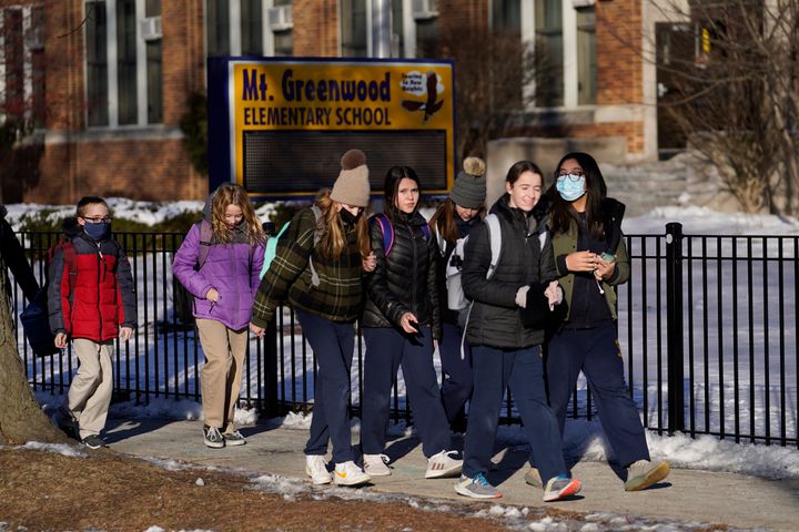 Students at Mt. Greenwood Elementary School in Chicago depart after a full day of classes following the strike in January 2022.