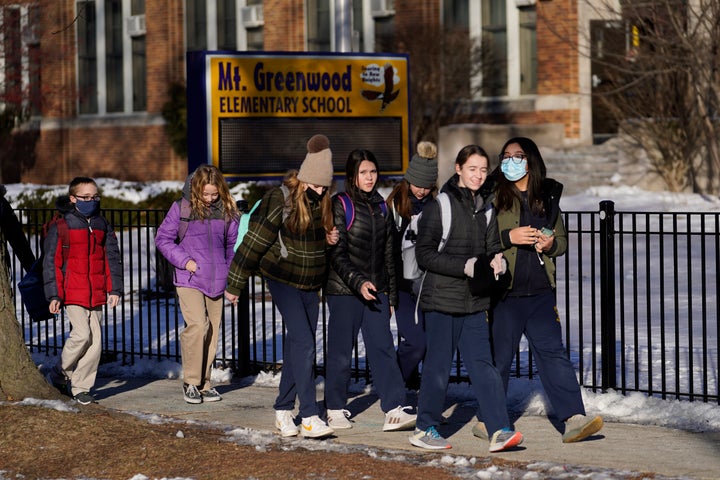 Students at Mt. Greenwood Elementary School in Chicago depart after a full day of classes following the strike in January 2022.