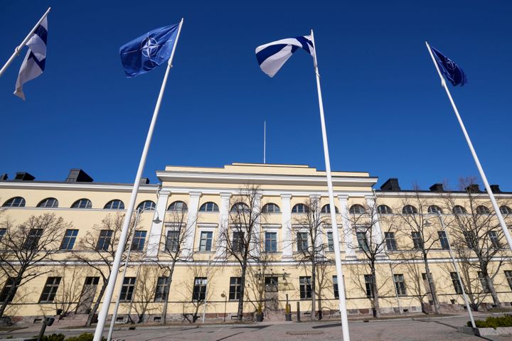 NATO and Finland flags flutter over the building of Ministry of Foreign Affairs in Helsinki, Finland, Tuesday, April 4, 2023. Finland prepared to make its historic entry into NATO Tuesday, a step that doubles the Western alliance’s border with Russia and ends decades of non-alignment for the Nordic nation. (AP Photo/Sergei Grits)
