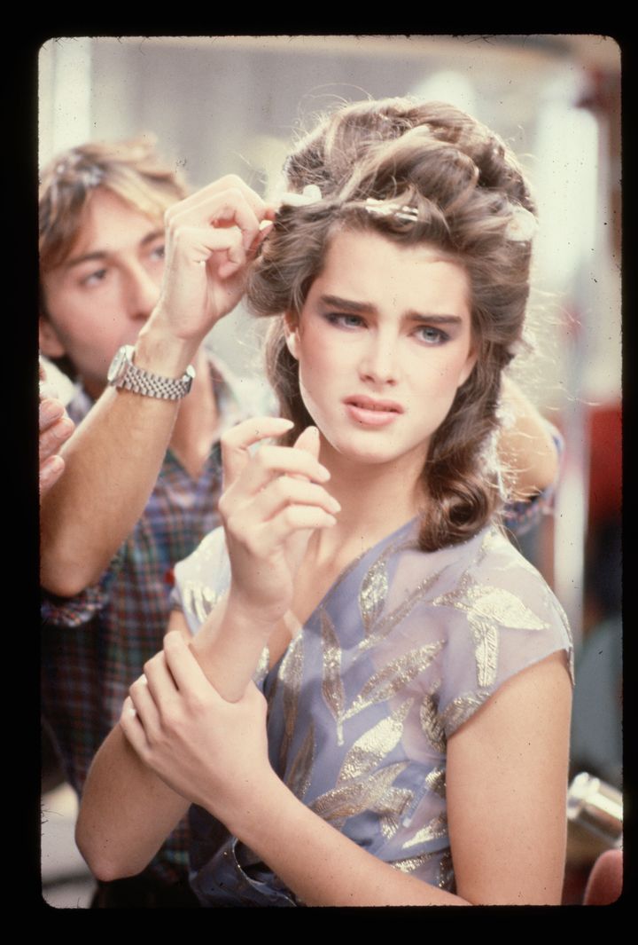 Shields has her hair done by a hairdresser before the filming of a commercial in the 1980s.