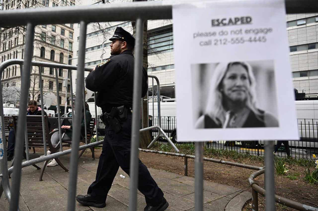 A fake "escaped" poster for Representative Marjorie Taylor Greene (R-Ga.) is seen in lower Manhattan.
