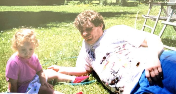 The author on their grandmother’s lawn with their dad (1997/1998).