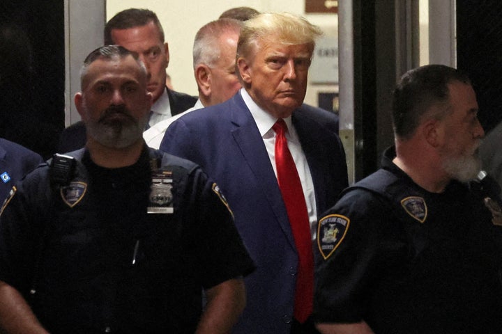 Former U.S. President Donald Trump arrives at Manhattan Criminal Courthouse, after his indictment by a Manhattan grand jury following a probe into hush money paid to porn star Stormy Daniels, in New York City, U.S., April 4, 2023. REUTERS/Brendan McDermid