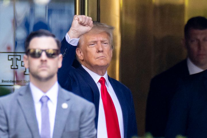 Former President Trump leaves Trump Tower for Manhattan Criminal Court on Tuesday. Trump was booked and arraigned on 34 felony counts related to hush money payments made during his 2016 campaign.