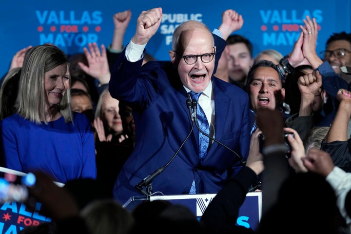 Paul Vallas, center, celebrates a strong showing in the first round of voting on Feb. 28 that enabled him to proceed to a runoff against Johnson on Tuesday.