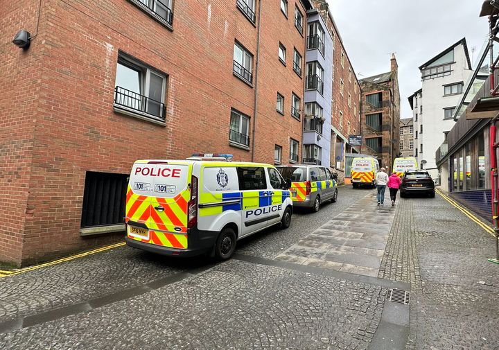 Police vans near the headquarters of the Scottish National Party (SNP) in Edinburgh following the arrest of former chief executive Peter Murrell. 