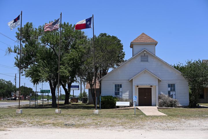 SUTHERLAND SPRINGS,TX - JUNE 7: Flags fly outside the former First Baptist Church on June 7, 2022 in Sutherland Springs, Texas. A gunman entered First Baptist Church in 2017 killing 26 people with an AR-15 style weapon during a mass shooting. (Photo by Joshua Lott/The Washington Post via Getty Images)