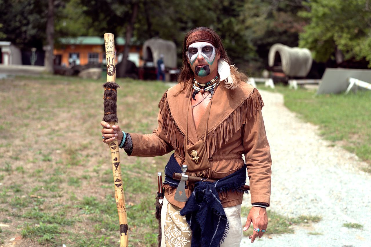 Jason “Jay” Musto, an American of Italian descent, portraying a Native American at Wild West City. He found the skull for his amulet in a piece of owl excrement.