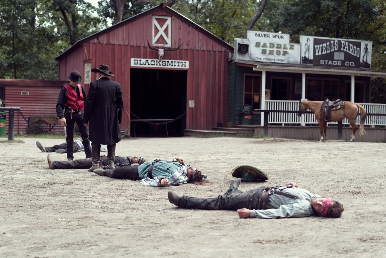 Actors pretending to be dead, during a skit at Wild West City.