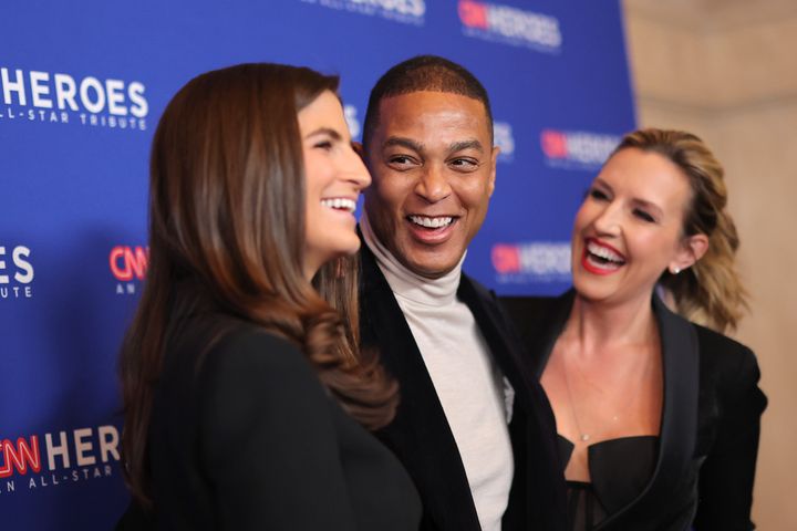 Don Lemon (center) poses with "CNN This Morning" co-anchors Kaitlan Collins (left) and Poppy Harlow (right) in December 2022. (Photo by Mike Coppola/Getty Images for CNN)