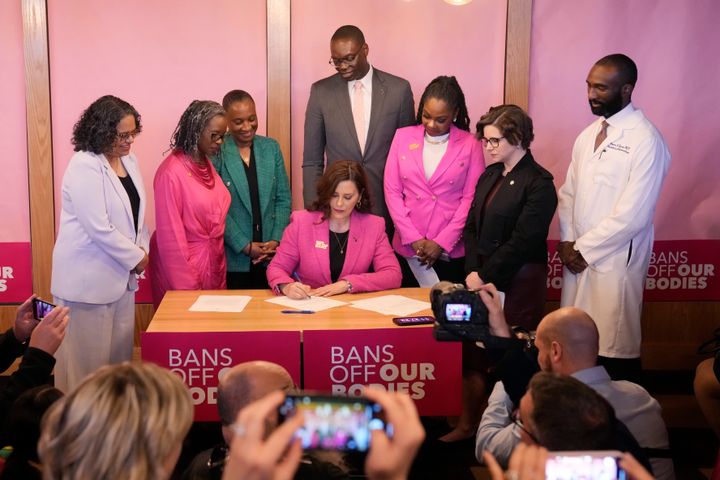 Gov. Whitmer signs legislation to repeal the 1931 abortion ban statute. The ban had been unenforceable after voters enshrined abortion rights in the state constitution last November. (AP Photo/Carlos Osorio)