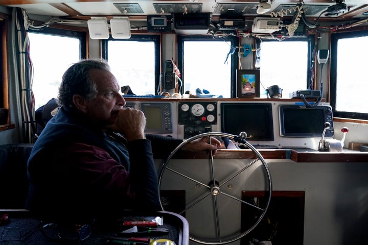 Bob Maharry sits inside his fishing boat docked at Pier 45 in San Francisco, March 20, 2023. A federal regulatory group has voted to officially close king salmon fishing season along much of the West Coast after near-record low numbers of the fish, also known as Chinook, returned to California's rivers in 2022. 