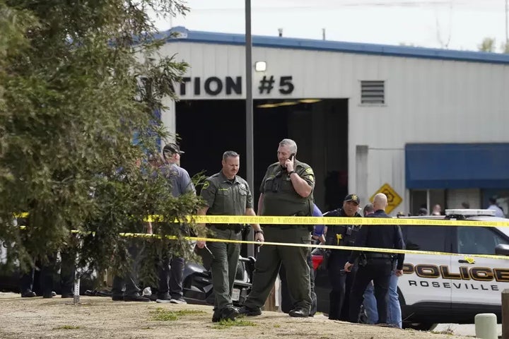 Authorities from various agencies gather at the command post next to local fitness center and library where a lockdown occurred in response to a shooting in Roseville, Calif. on April 6. At least three people have been hospitalized.