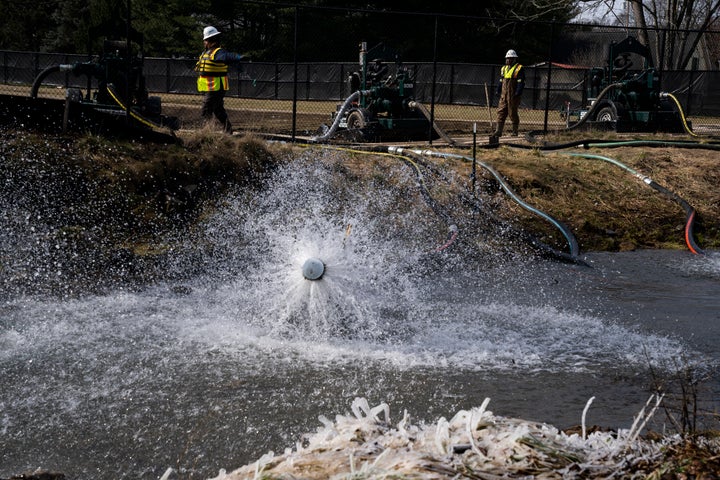 Contractors conduct cleanup work in Leslie Run, a creek in East Palestine, Ohio, on March 9.