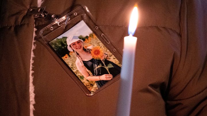 A photo of Abby Zwerner is pinned to a coat during a vigil for the teacher, who was shot and injured by a 6-year-old student at Richneck Elementary in Newport News, Virginia, in January.