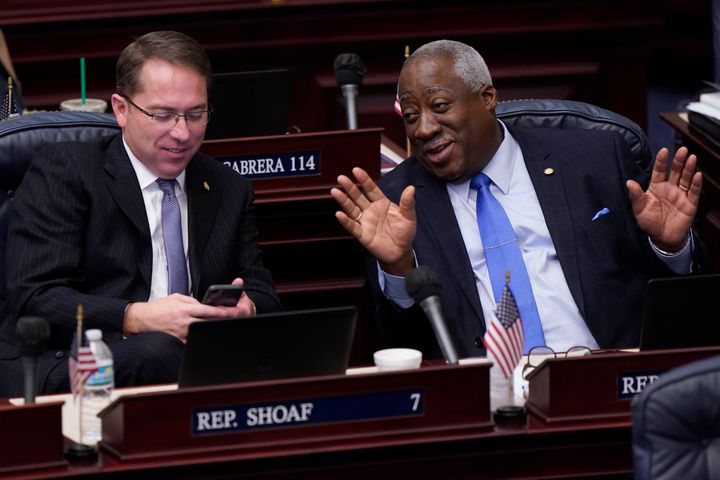 Florida Representatives Webster Barnaby (right) and Jason Shoaf (left) chat during a break in a legislative session on April 30, 2021. 