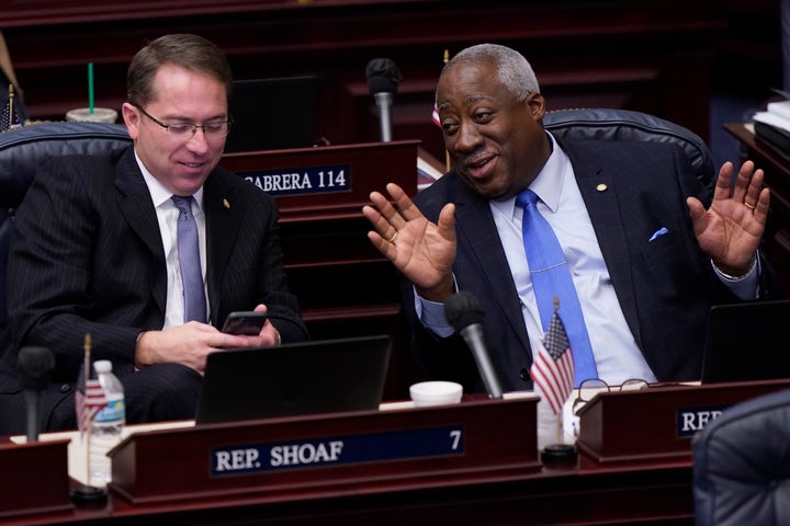 Florida Representatives Webster Barnaby (right) and Jason Shoaf (left) chat during a break in a legislative session on April 30, 2021.