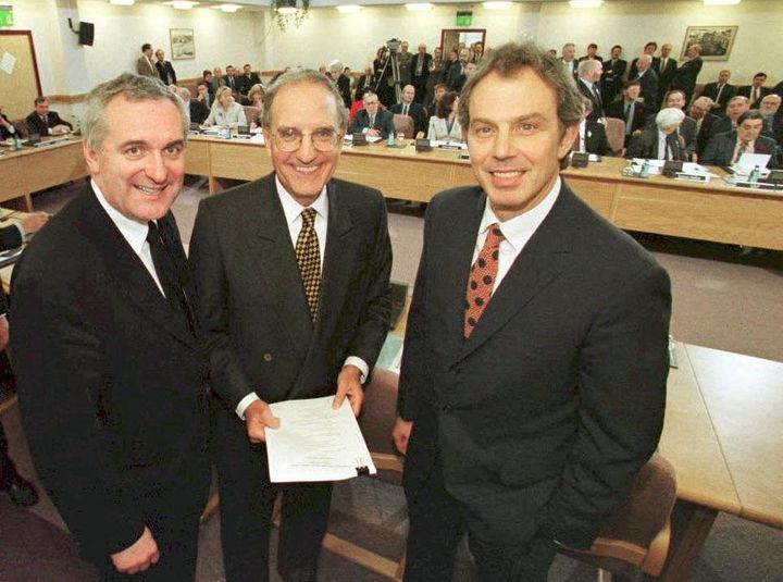 Former Prime Minister Tony Blair, US Senator George Mitchell and Irish Prime Minister Bertie Ahern on April 10, 1998, after they signed an historic agreement for peace in Northern Ireland, ending a 30-year conflict.