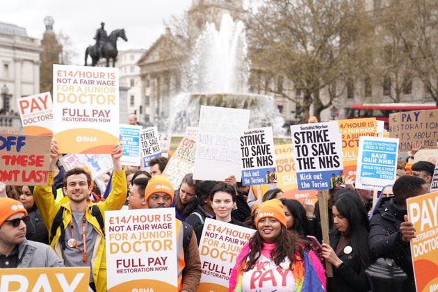 People take part in a rally in Trafalgar Square in London, in support of striking NHS junior doctors, as the British Medical Association holds a 96-hour walkout in a dispute over pay.