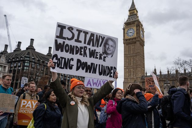 Junior doctors pass Big Ben as they take part in a rally during a nationwide strike.