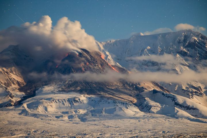 In this file photo from Nov. 6, 2022, lava and steam are visible during an earlier eruption of the Shiveluch volcano. (Yury Demyanchuk, The Russian Academy of Sciences' Vulcanology Institute via AP, File)