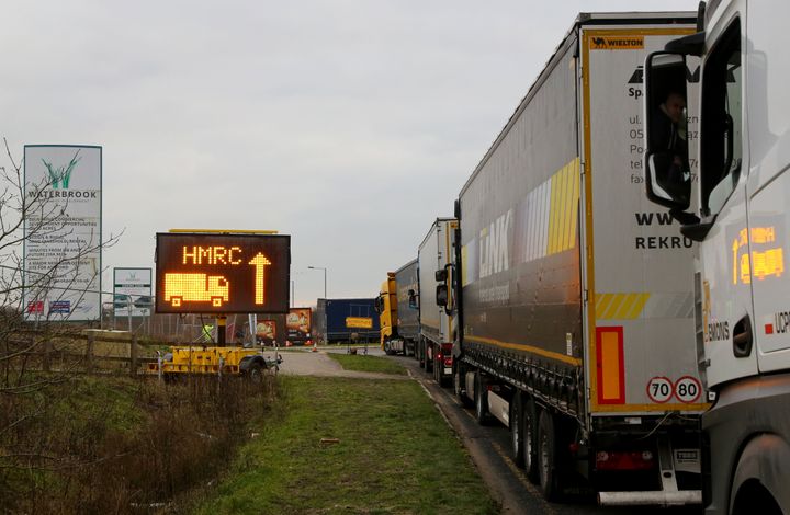 Lorries queue for a customs facility in Ashford, Kent, as Channel traffic builds up following the end of the transition period with the European Union.