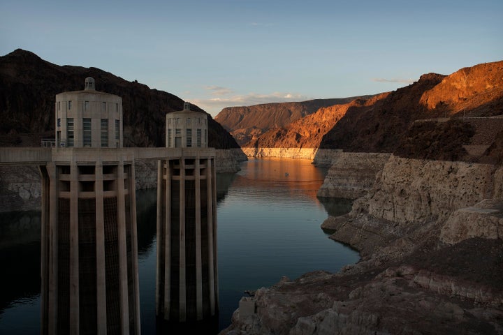 Light mineral bathtub rings show Lake Mead's high water line near the water intake on the Arizona side of the Hoover Dam at Lake Mead National Recreation Area Sunday, June 26, 2022, near Boulder City, Nev.