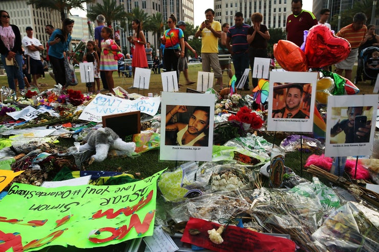 People visit a memorial for those killed at Pulse nightclub on June 16, 2016, in Orlando, Florida, where 49 people were killed and 53 others were wounded.