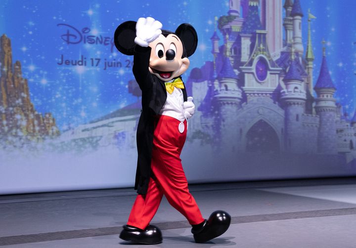 Mickey Mouse joins the president of Disneyland Paris as parks reopen on June 17, 2021.