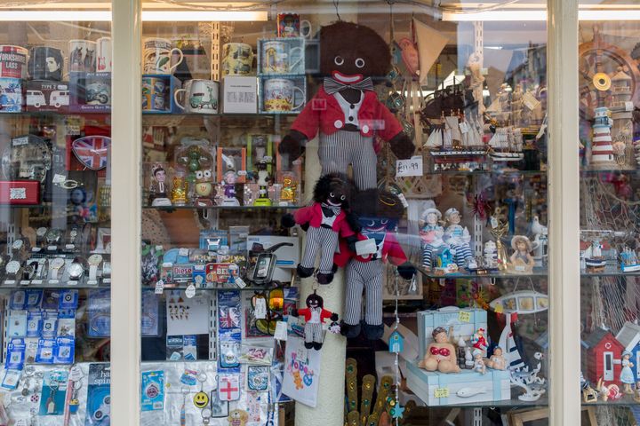 Detail of a shop window selling seaside holiday trinkets including different sizes of Golliwogs, on 14th July 2017, at Scarborough, North Yorkshire.