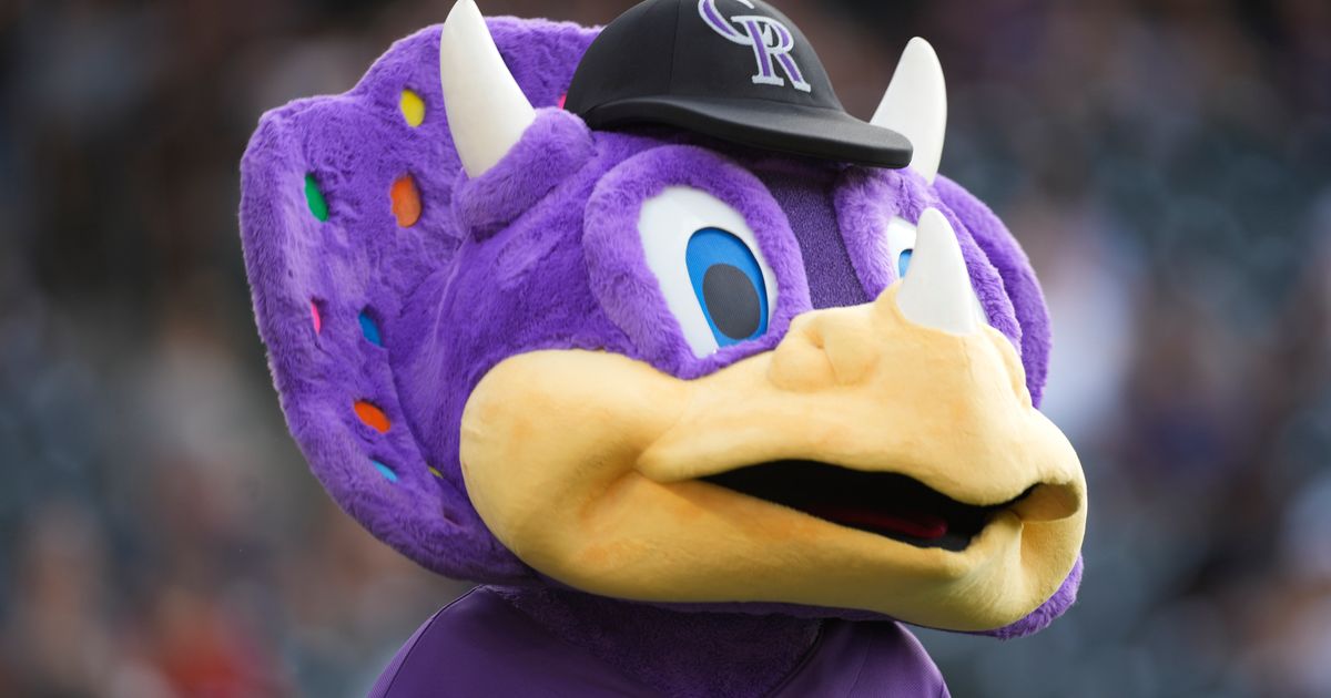 Video shows fan tackling Rockies mascot Dinger on top of dugout