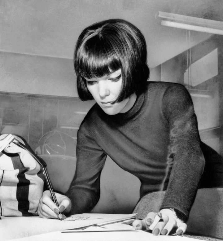 British fashion designer Mary Quant is seen at work in London, England in 1963. (AP Photo)