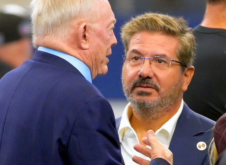 Washington Commanders owner Dan Snyder (right) talks to Cowboys owner Jerry Jones (left) at AT&T Stadium on Oct. 2, 2022, in Arlington, Texas.