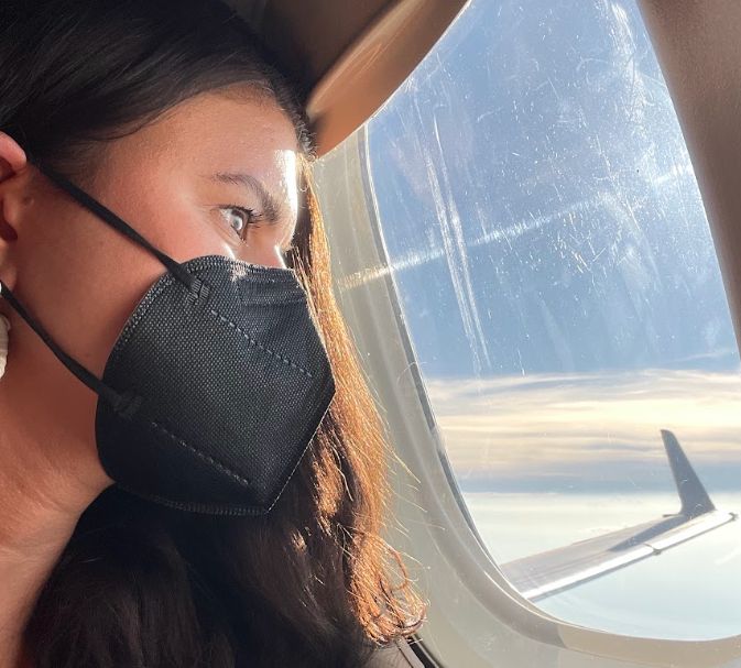 The author looking out the window of a plane during her year of Grieve Leave.
