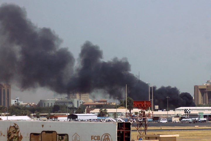 Heavy smoke bellows above buildings in the vicinity of the Khartoum's airport on April 15, 2023, amid clashes in the Sudanese capital. - Explosions rocked the Sudanese capital on April 15 as paramilitaries and the regular army traded attacks on each other's bases, days after the army warned the country was at a "dangerous" turning point. (Photo by AFP) (Photo by -/AFP via Getty Images)