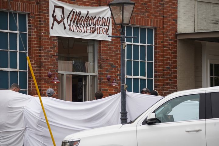 Investigators on Sunday block the scene of a shooting at the Mahogany Masterpiece dance studio in Dadeville.
