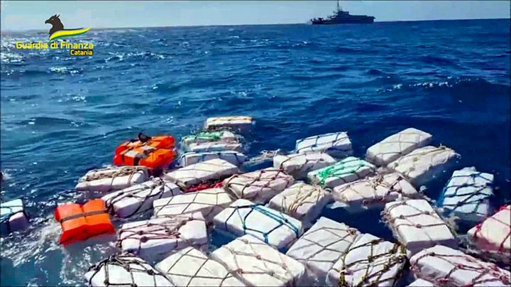 Boxes containing cocaine float in the Sicilian Strait off Catania in this picture made available by the Italian Financial Police on Monday, April 17, 2023. Some two thousand kilograms of cocaine, left afloat in open waters with a tracking device attached, were sized by the Italian Financial Police on Monday. (Italian Financial Police via AP)