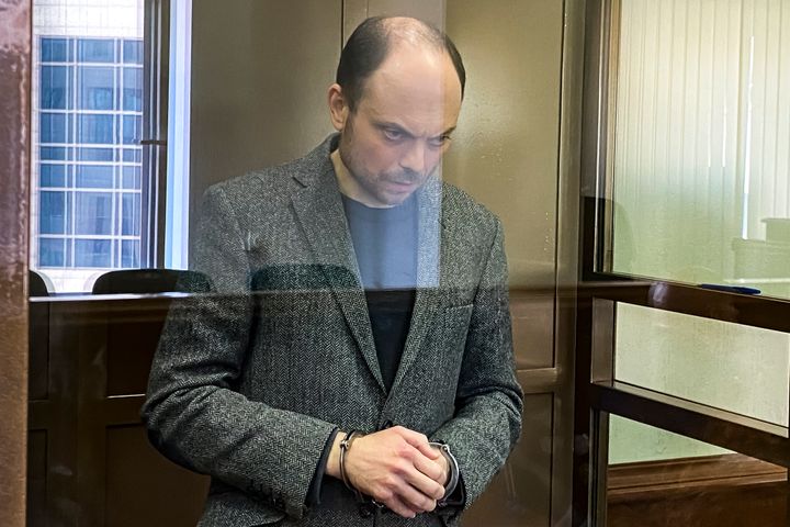 Russian opposition activist Vladimir Kara-Murza stands in a glass cage in a courtroom at the Moscow City Court in Moscow on Monday April 17, 2023.