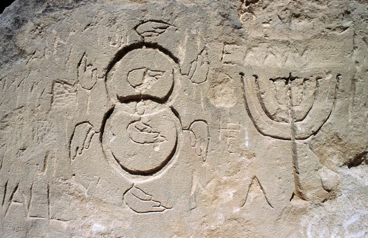 GREECE - JUNE 21: Engravings (seven-branched candelabrum or menorah), near the Church in the Rock (cave church of Agia Agathi), near Haraki (Charaki), Rhodes island, Greece. (Photo by DeAgostini/Getty Images)
