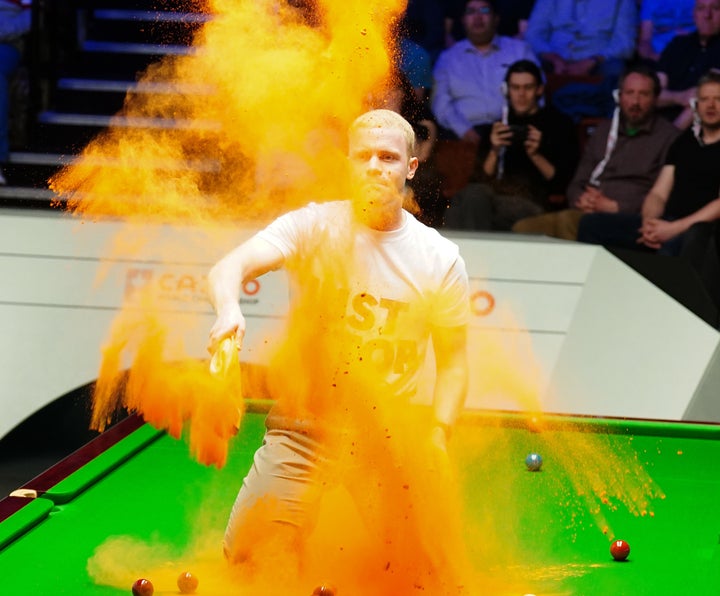 Just Stop Oil protester jumped on the table during a snooker match in Sheffield.