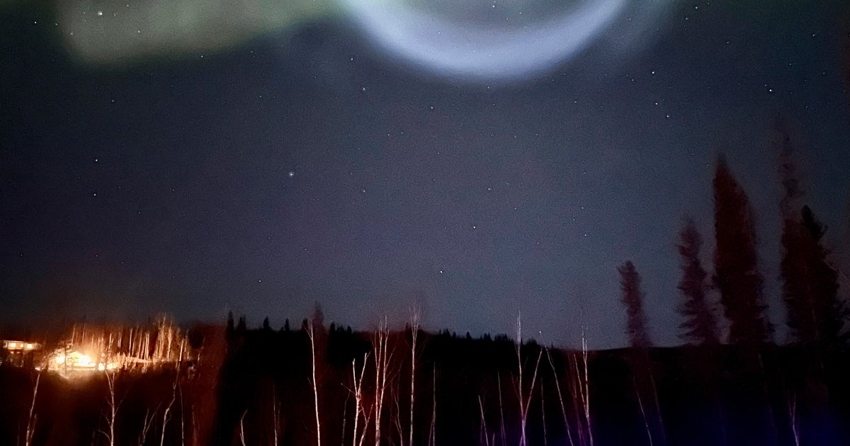 Odd Spiral Appears Amid Northern Lights In Alaska Night Sky Odd Spiral Appears Amid Northern Lights In Alaska Night Sky