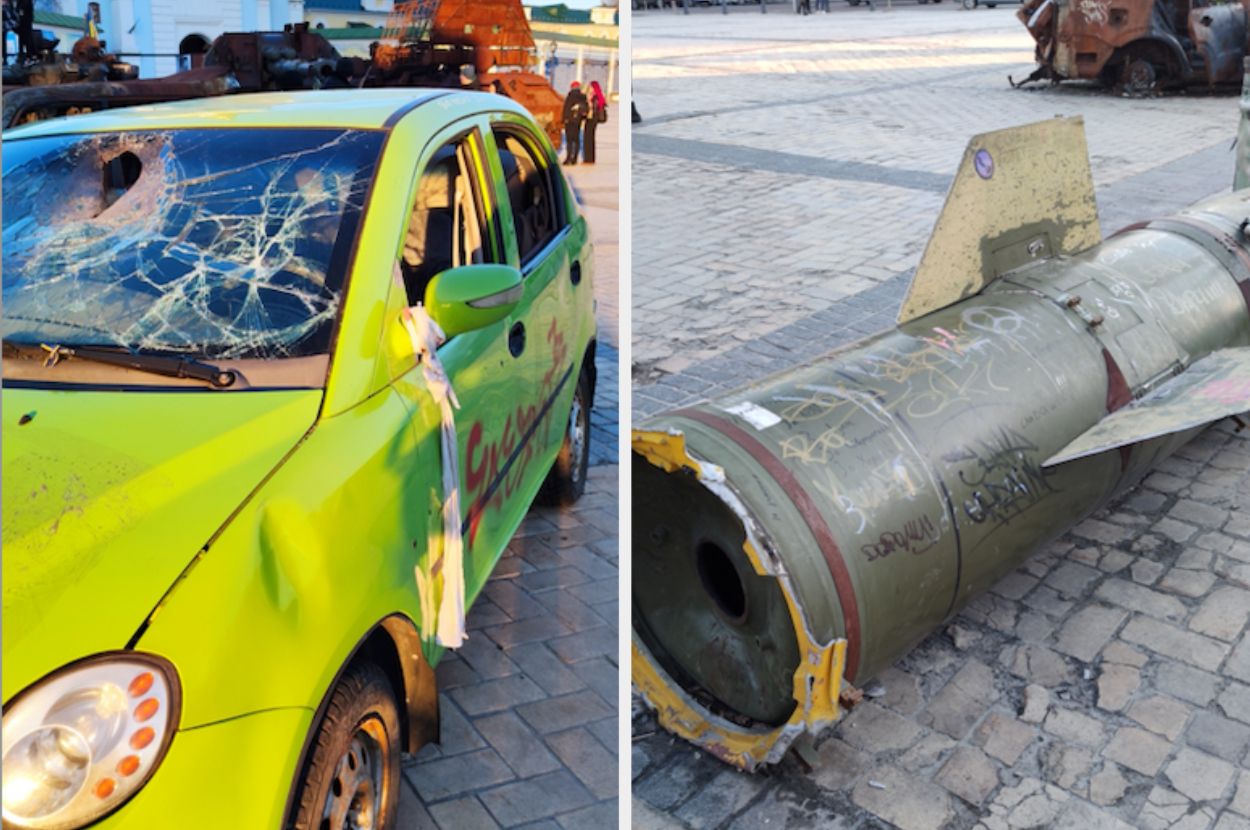 Markers of war are scattered around the city, including a damaged car and a rocket