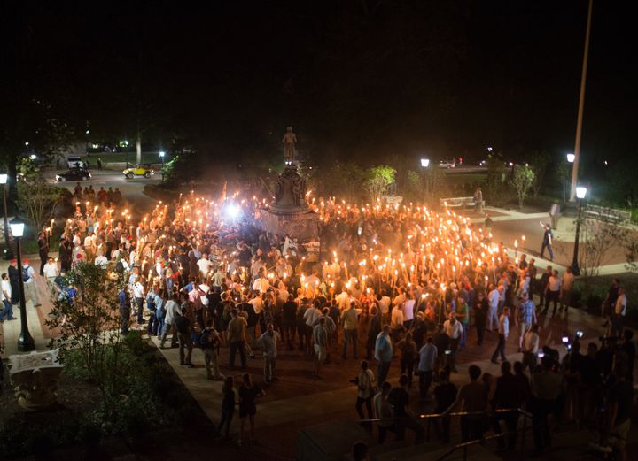 Neo Nazis, Alt-Right, and White Supremacists encircle counter-protestors at the base of a statue of Thomas Jefferson after marching through the University of Virginia campus with torches in Charlottesville in 2017.