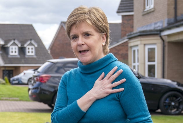 Nicola Sturgeon speaking to the media outside her home in Uddingston after her husband Peter Murrell, was 