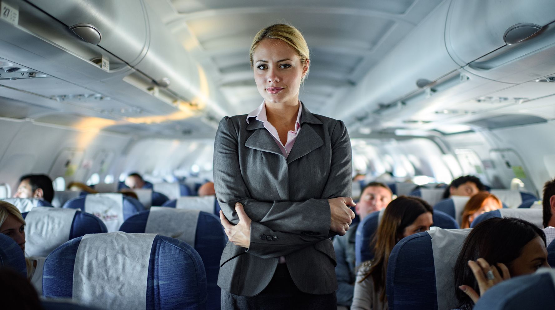 Flight attendant sits on the floor to comfort passenger - Upworthy