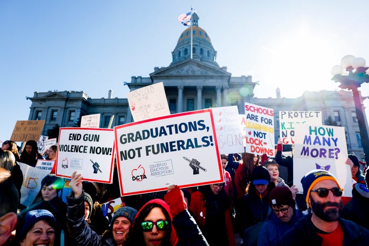 People march around the Colorado State Capitol during a protest to end gun violence in schools on March 24 in Denver.