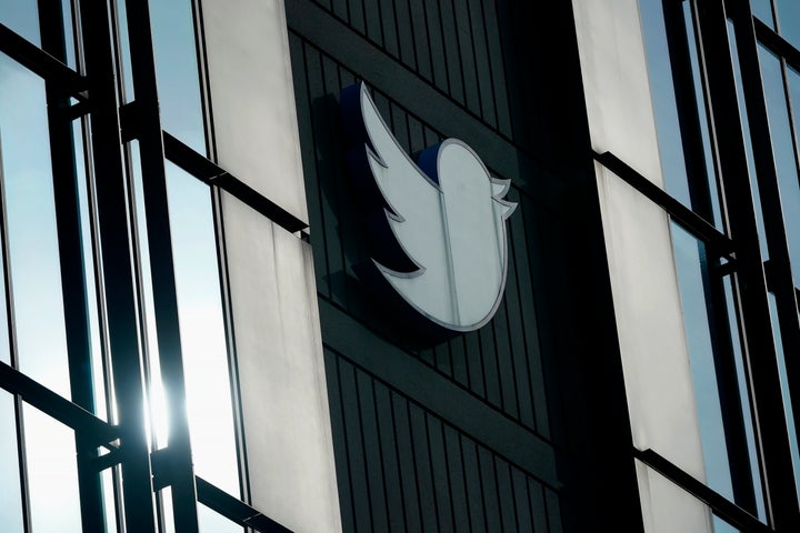 FILE - A Twitter logo hangs outside the company's offices in San Francisco, on Dec. 19, 2022. 