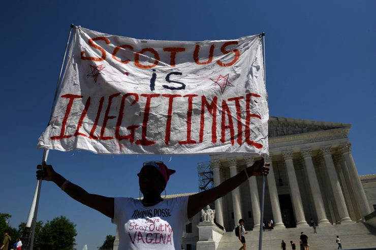 A woman holds a sign in support of abortion rights at the U.S. Supreme Court on Friday.